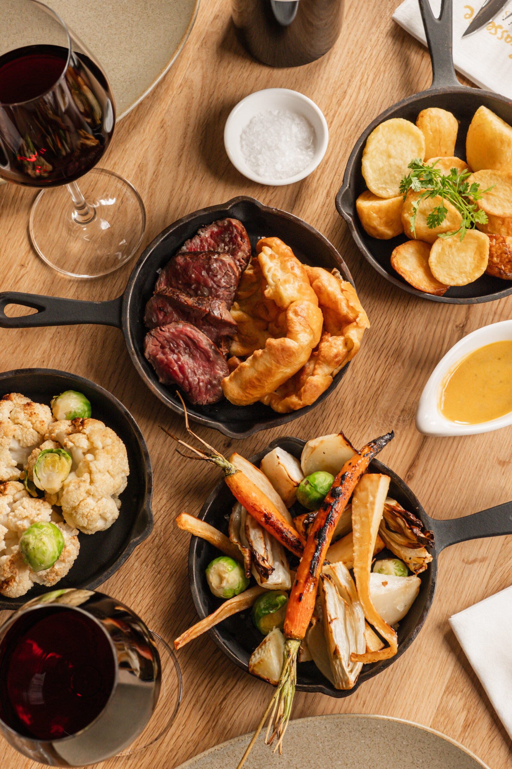Traditional Sunday roast meal served with roasted vegetables and gravy